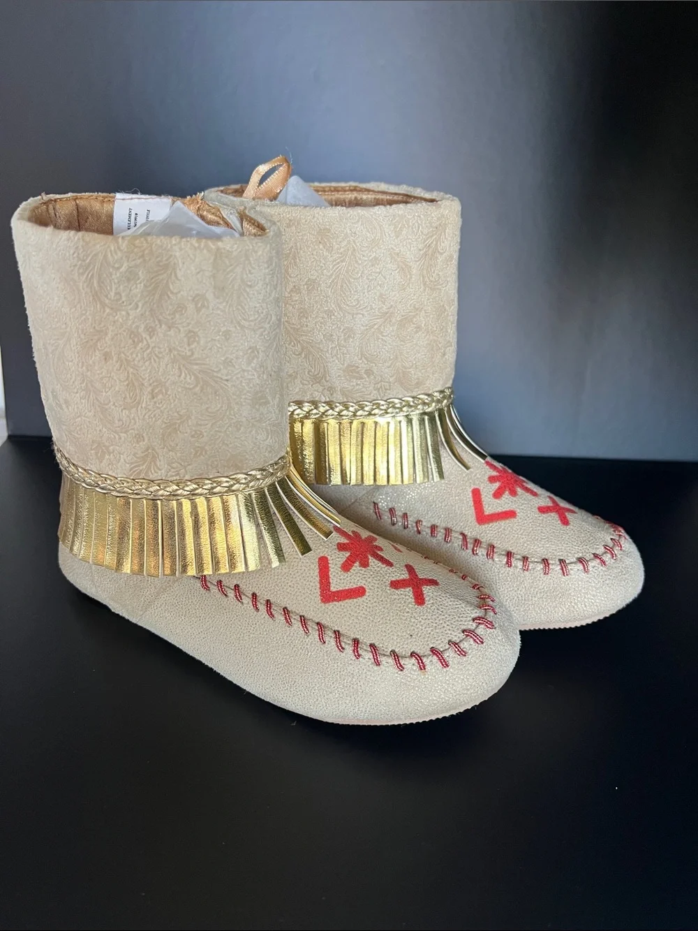 Disney Beige Moccasin Boots with Gold Fringe and Red Embroidery